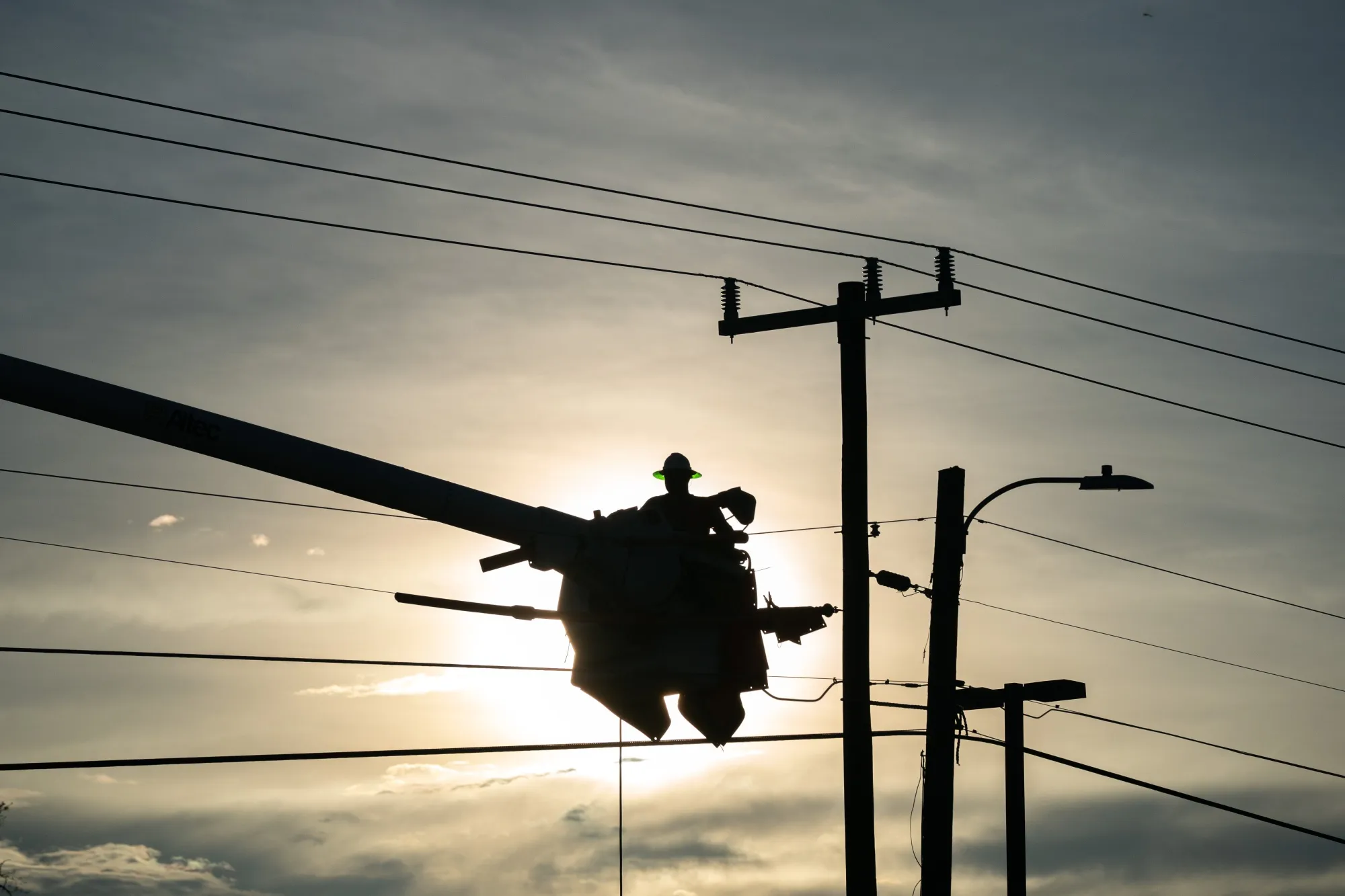 A lineman works to restore service in Perry, Florida.
