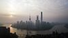 The Oriental Pearl Tower, center left, Shanghai World Financial Center, center, and the Shanghai Tower, center right, stand among other buildings in the Lujiazui Financial District along the Pudong riverside in this aerial photograph taken above Shanghai, China, on Monday, April 2, 2018. China's sprawling local government financing system needs "crucial" reforms to increase consumption, build prosperity and encourage economic rebalancing, the International Monetary Fund said.