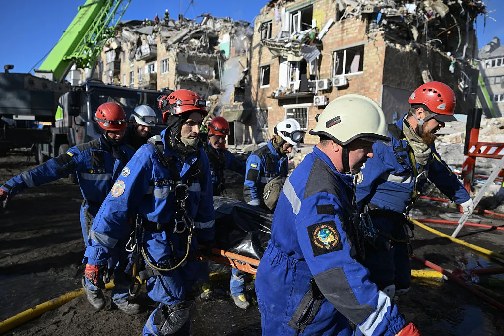 Search and rescue operations at the site of a residential building, heavily damaged following a Russian missile strike in Kyiv.