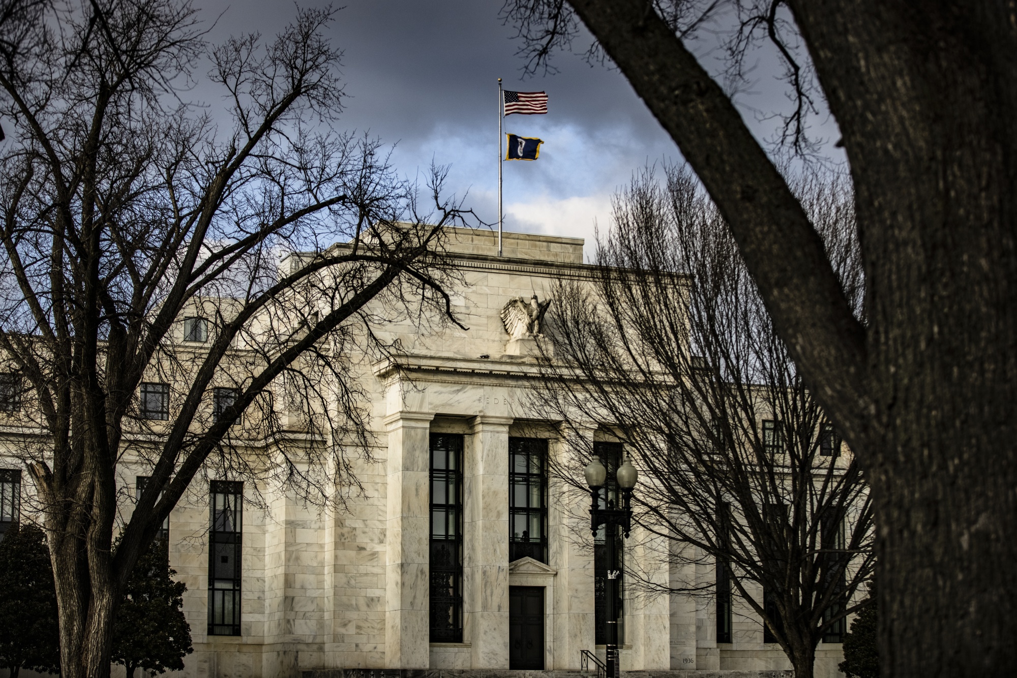 Fed officials saw the pace of bond buying continue for 'a while'