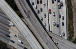 Vehicles move along the Interstate 405 freeway during rush hour in Los Angeles, California.