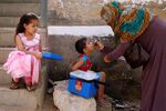 Children receiving polio drops in April during an anti-polio campaign in Karachi, Pakistan.