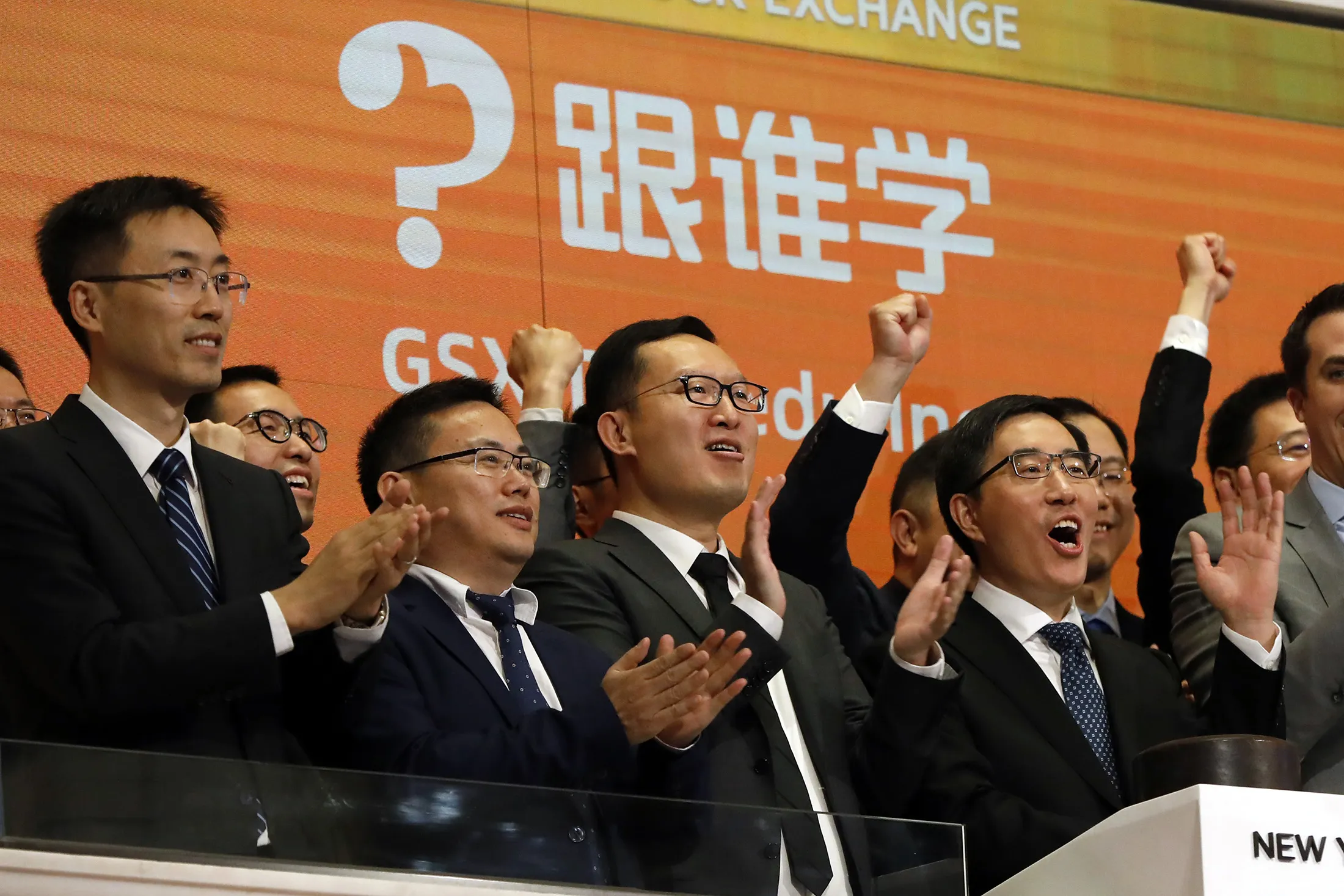 Larry Chen, right, at the New York Stock Exchange in 2019. 