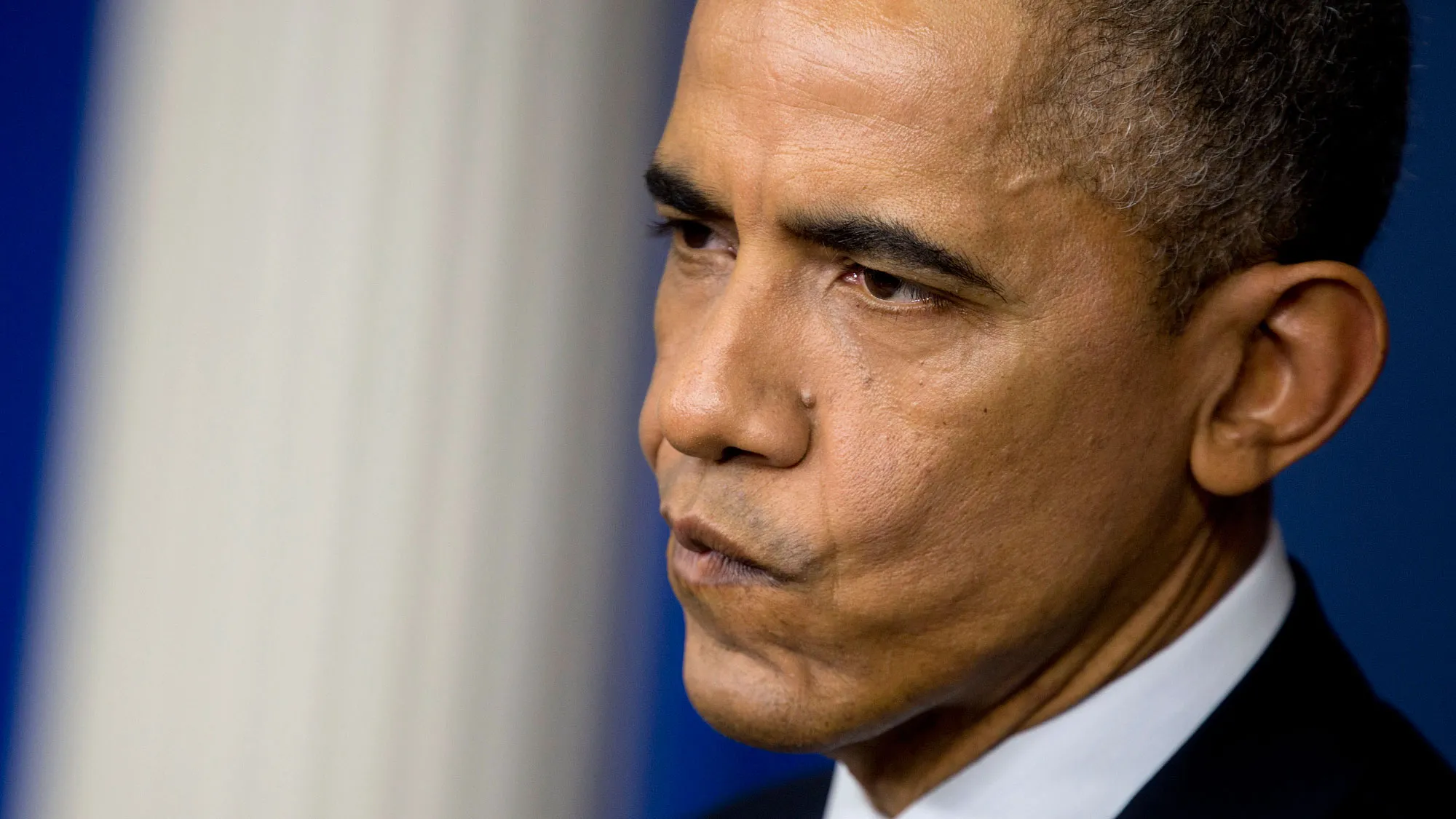 U.S. President Barack Obama listens to a question during a news conference at the White House in Washington, D.C., U.S., on Friday, Dec. 19, 2014.
