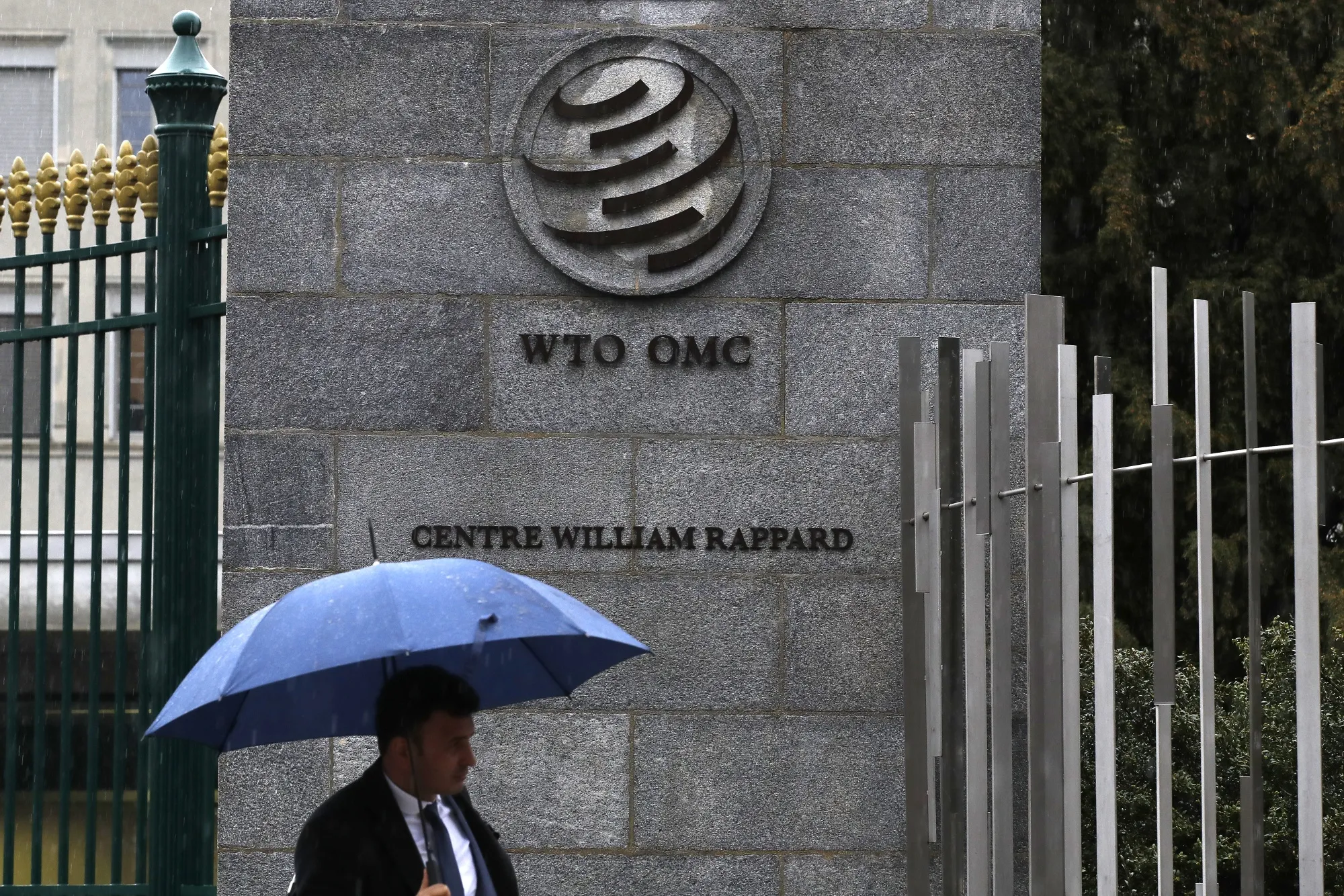 A pedestrian outside the WTO in Geneva.