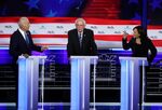 Kamala Harris, Joe Biden, and Bernie Sanders during the first Democratic presidential debate on June 27.