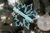 A branded ornament hangs on a Christmas tree at a Tiffany & Co. store in Shanghai.