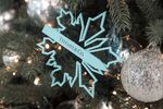 A branded ornament hangs on a Christmas tree at a Tiffany & Co. store in Shanghai.