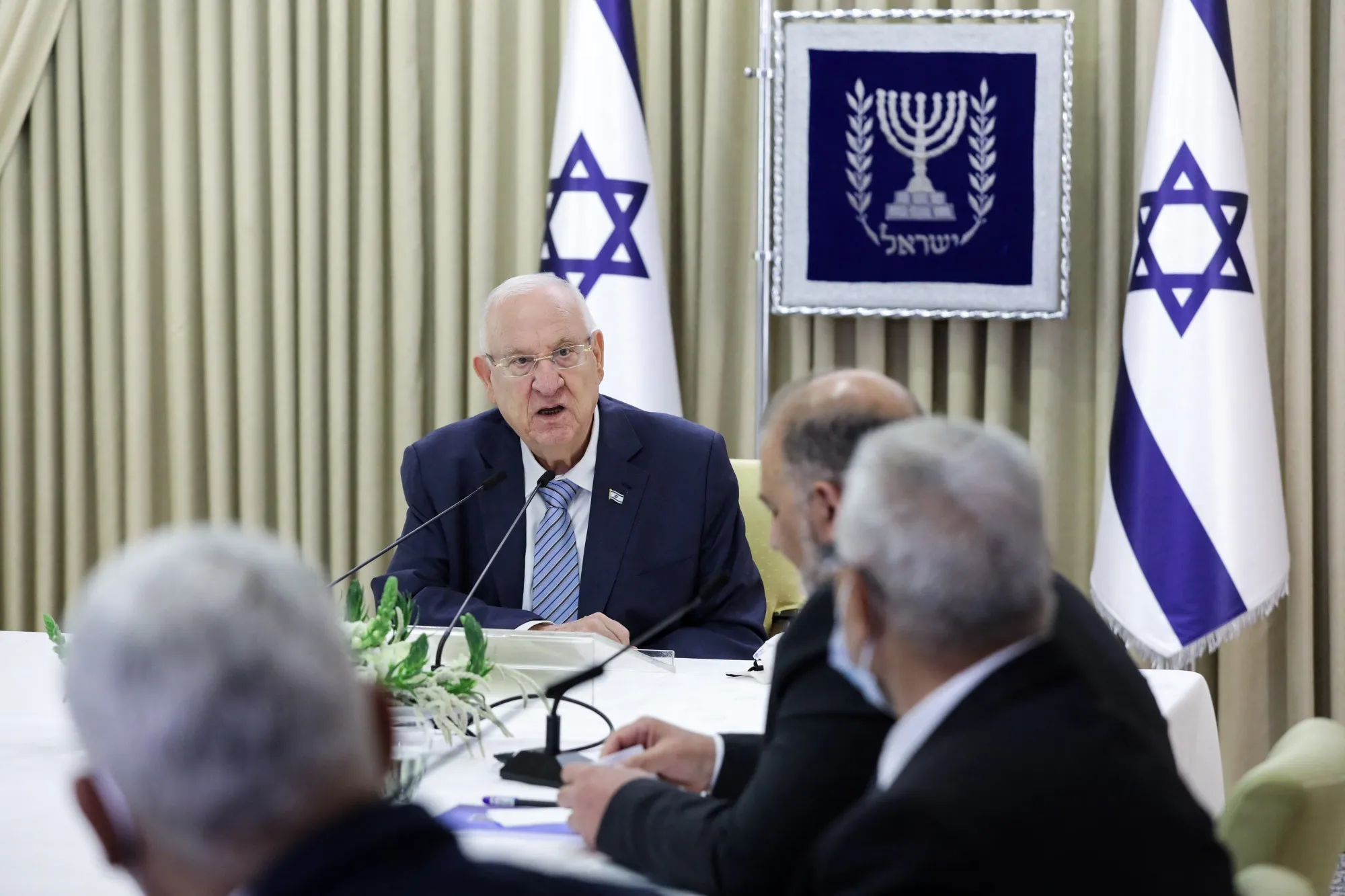 Israeli President Reuven Rivlin speaking with Israeli Arab politician Mansour Abbas in April.