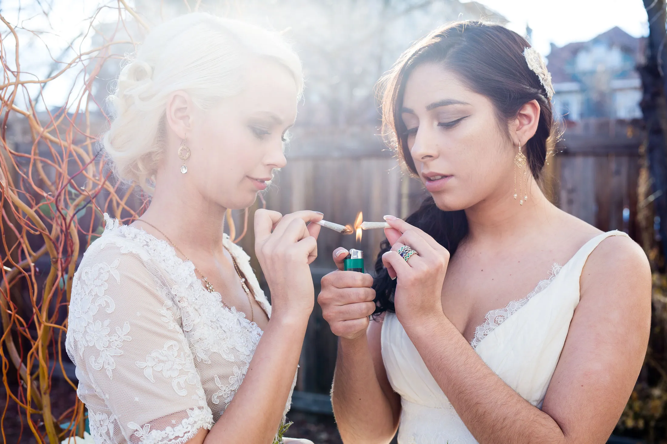 Brides, wearing hemp silk wedding dresses, share a "first toke."&nbsp;
