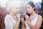 Brides, wearing hemp silk wedding dresses, share a "first toke." 