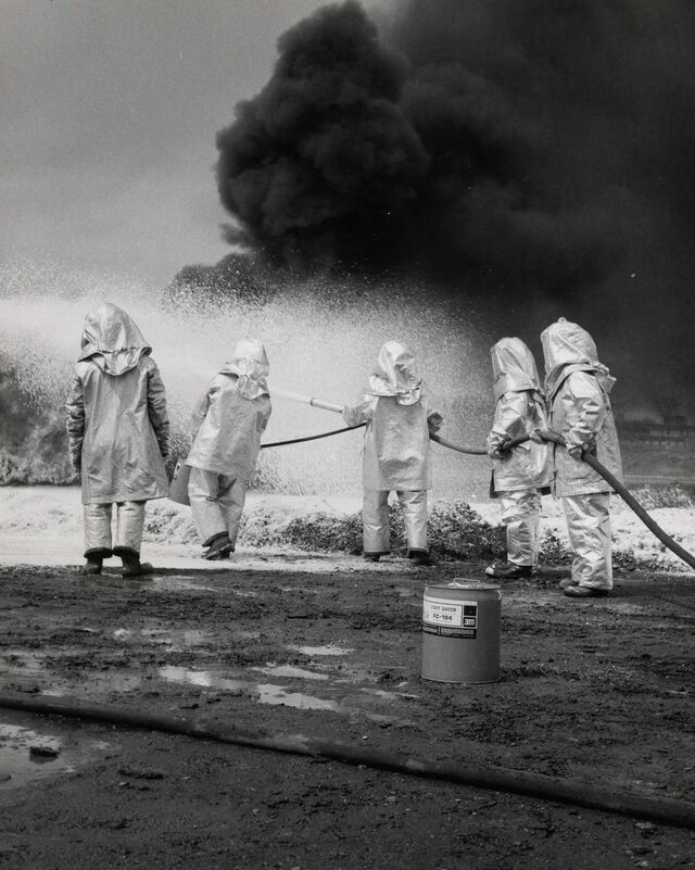 Firefighters use a 3M product to put out an oil fire, circa 1968. 