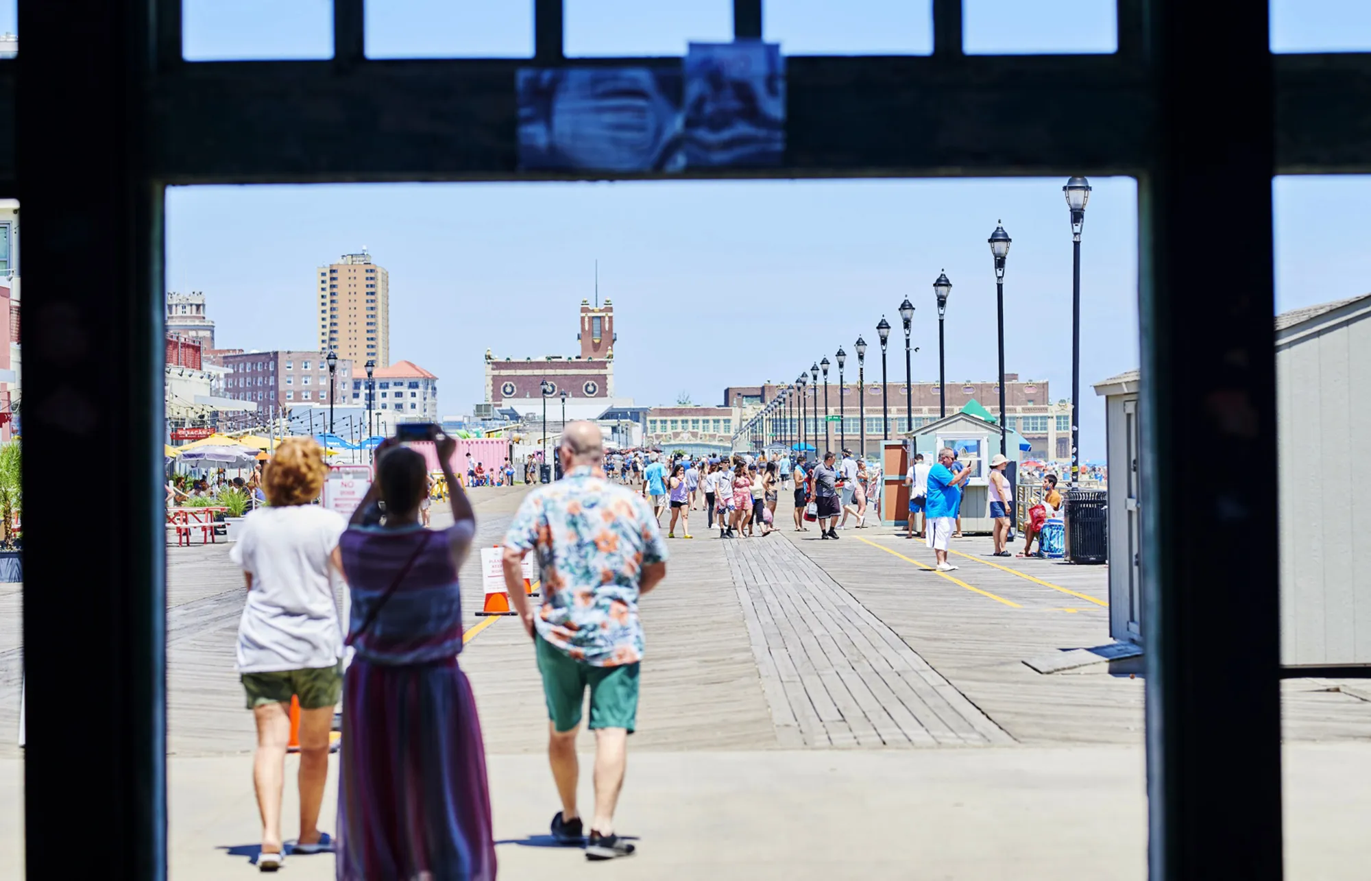 People walk on the boardwalk in Asbury Park, New Jersey on July 9.&nbsp;