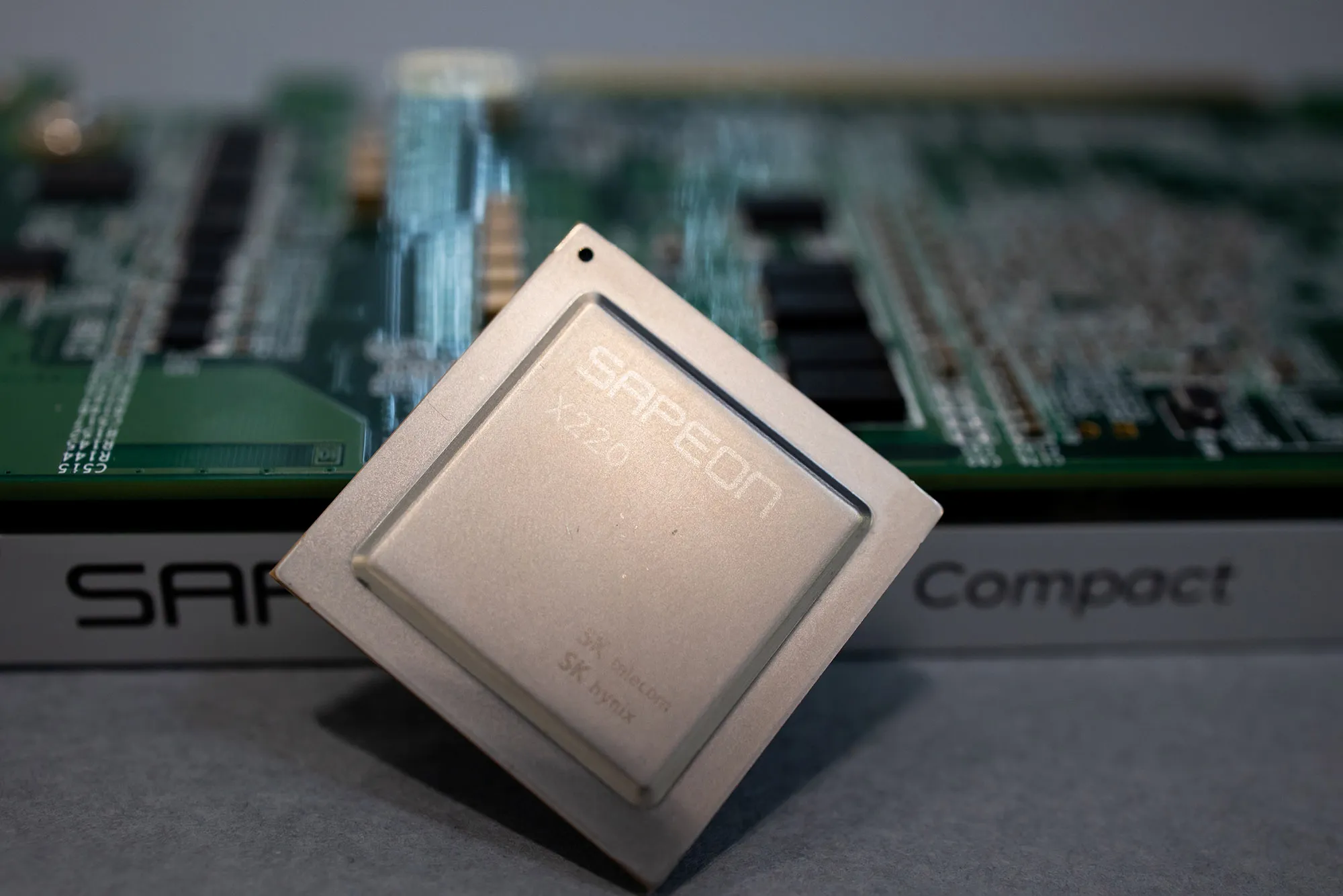 SK Telecom Co. Sapeon X220 AI semiconductor chip and board are arranged at the company's office in Seongnam, South Korea, on Wednesday, Nov. 25, 2020. The Sapeon X220 is designed to speed up servers that cater to a growing number of mobile devices - from drones to self-driving vehicles - that perform better with AI.