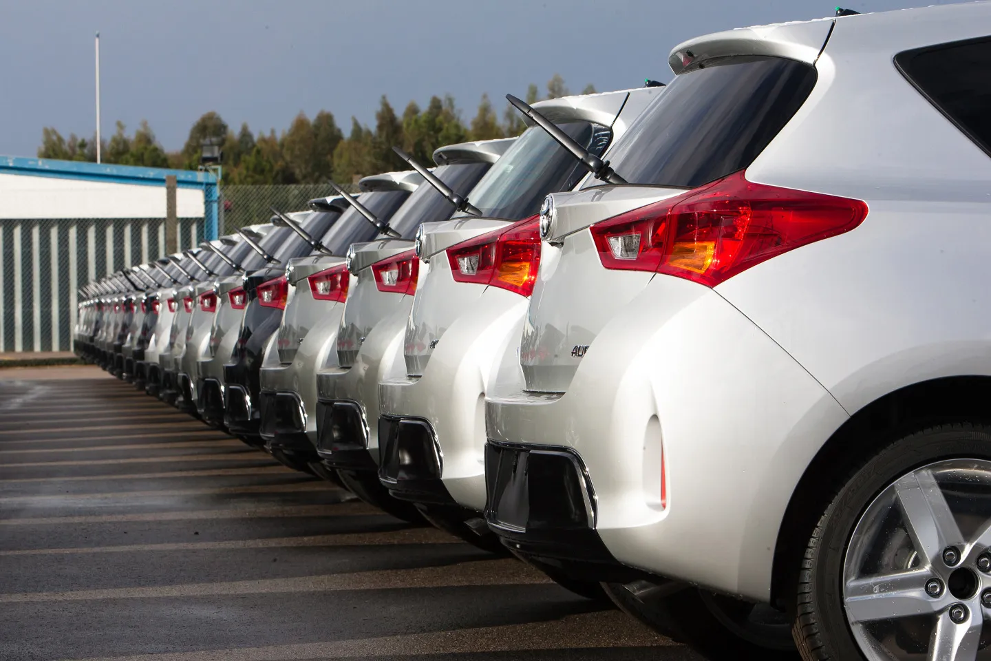 A row of Toyota Auris Hybrid Touring Sports automobiles, produced by Toyota Motor Corp., stand outside the Toyota Caetano Portugal S.A. factory before shipping in Ovar, Portugal, on Thursday, Dec. 19, 2013. Toyota Motor Corp., the world's biggest carmaker, is targeting sales and profitability gains in Europe and Russia next year on the strength of its increasingly popular hybrid models.