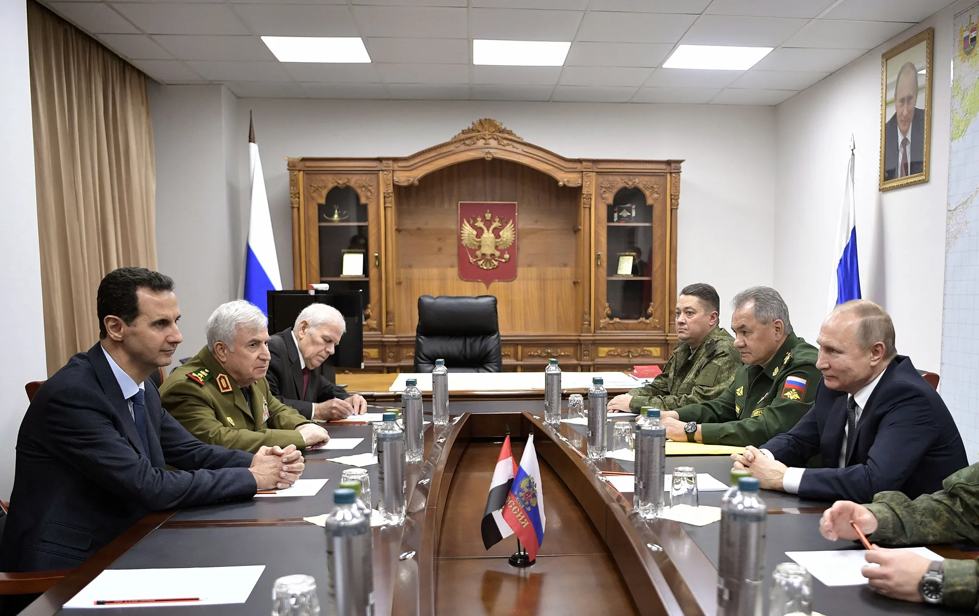 Bashar al-Assad, left, and Vladimir Putin, right, meet in Damascus on Jan. 7.