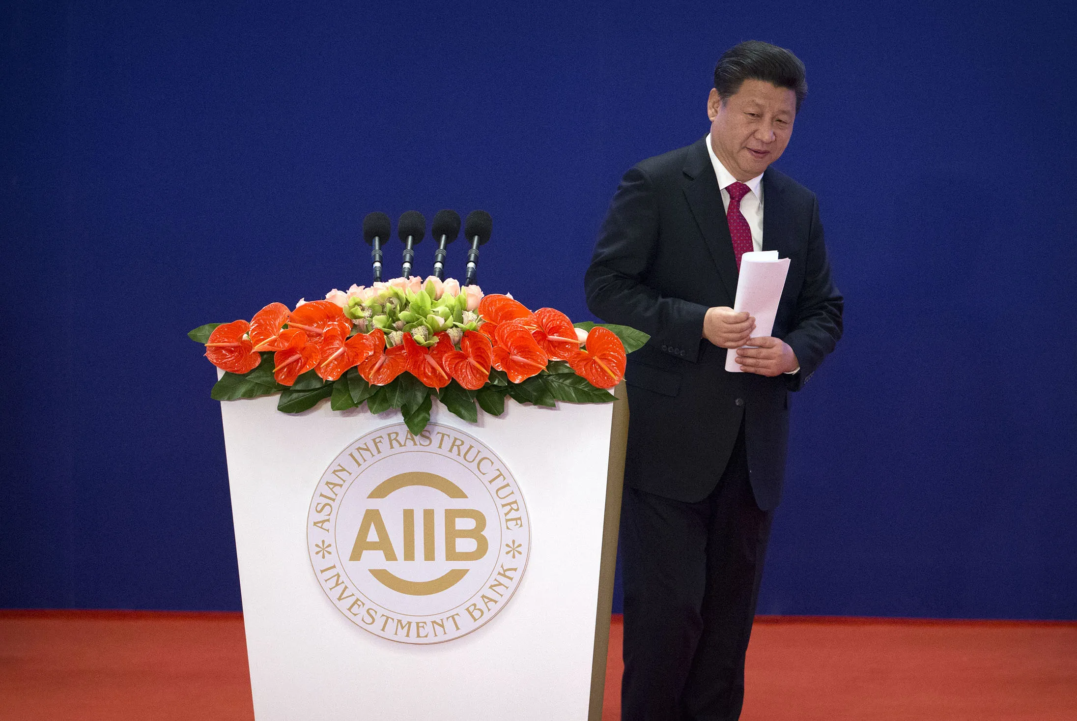 Chinese President Xi Jinping leaves the podium after speaking during the opening ceremony of the Asian Infrastructure Investment Bank (AIIB) in Beijing on Saturday.
