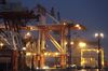 A gantry crane unloads a container from the Jacques Joseph container ship, operated by CMA CGM SA, berthed at a shipping terminal at night in Yokohama, Japan, on Thursday, July 11, 2019. Japan and South Korea plan to meet on Friday over Tokyo’s move to restrict vital exports to its neighbor, but neither has much political incentive to climb down from their worst dispute in decades.