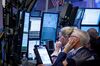 Traders work on the floor of the New York Stock Exchange (NYSE)