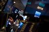 A trader works on the floor of the New York Stock Exchange (NYSE) in New York, U.S., on Thursday, March 29, 2018. U.S. stocks climbed as markets moved toward the end of a tumultuous quarter on a high note. Equities in Europe also rose following a mixed session in Asia.