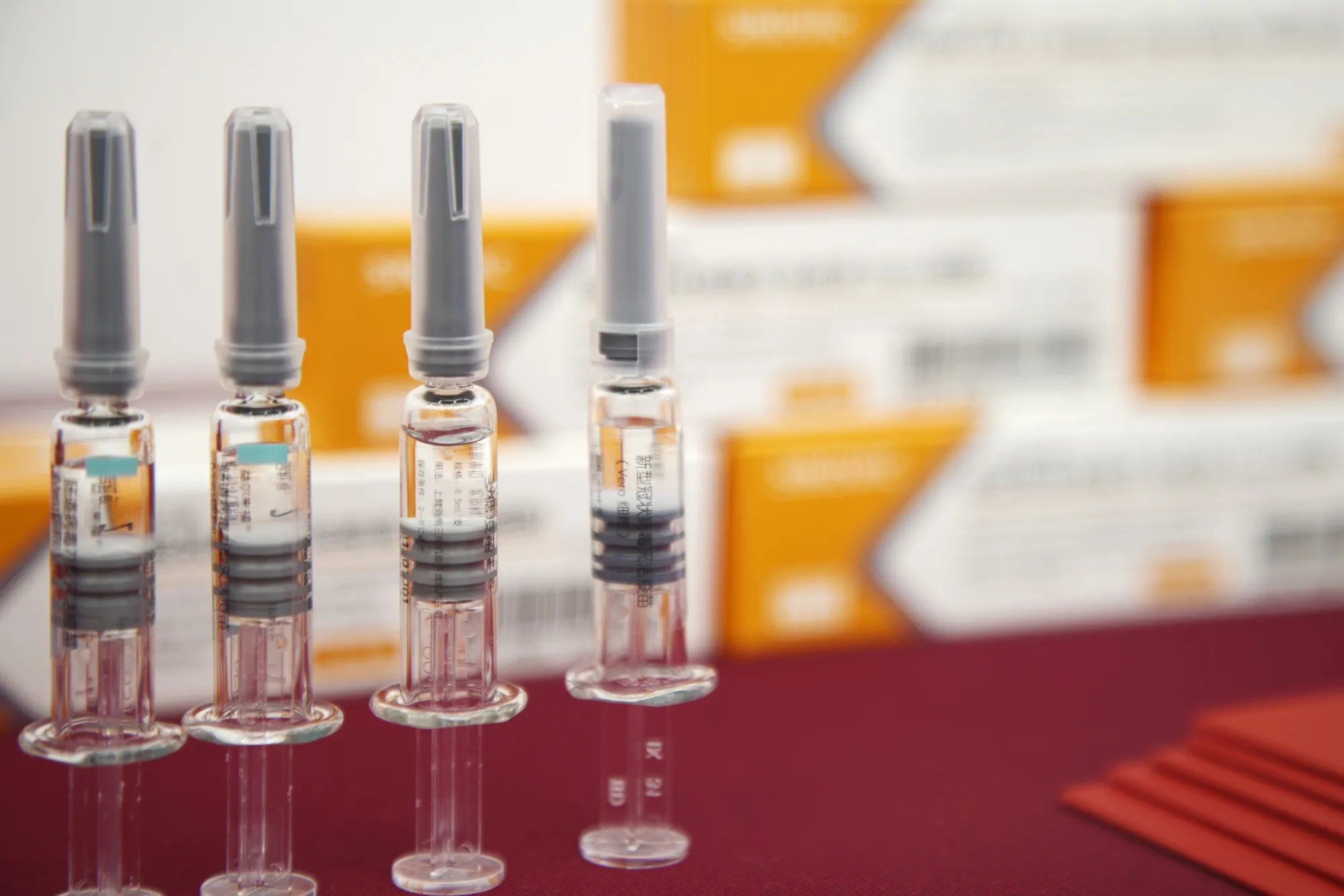Vials of Sinovac’s CoronaVac SARS-CoV-2 vaccine are displayed at a media event in Beijing, China, on Sept. 24.