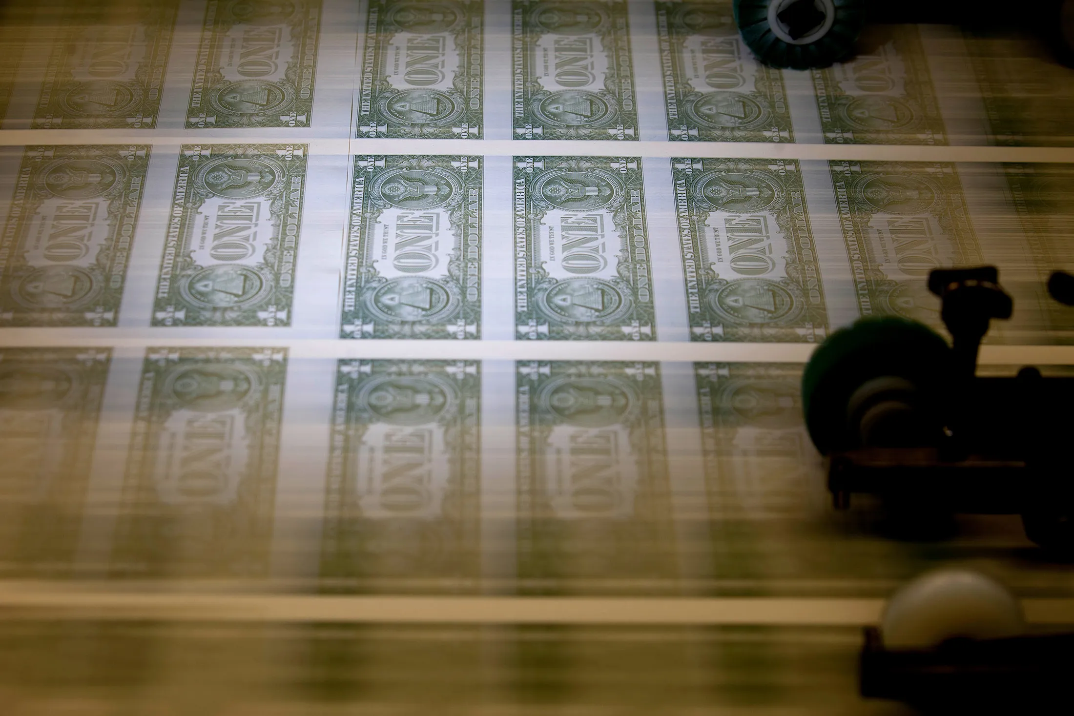 Operations At The Bureau Of Engraving And Printing As The $1 Bill Is Printed