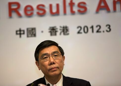 Record Profit Nets Jiang $308,000 Versus Dimon’s $23 Million Pay