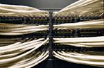 Cables run into a Cisco Systems network data switch in New York, Wednesday, August 8, 2007. Cisco Systems Inc. shares climbed the most in nine months after the company increased its sales forecast on demand for high-speed Internet gear and Web-based phone systems.
