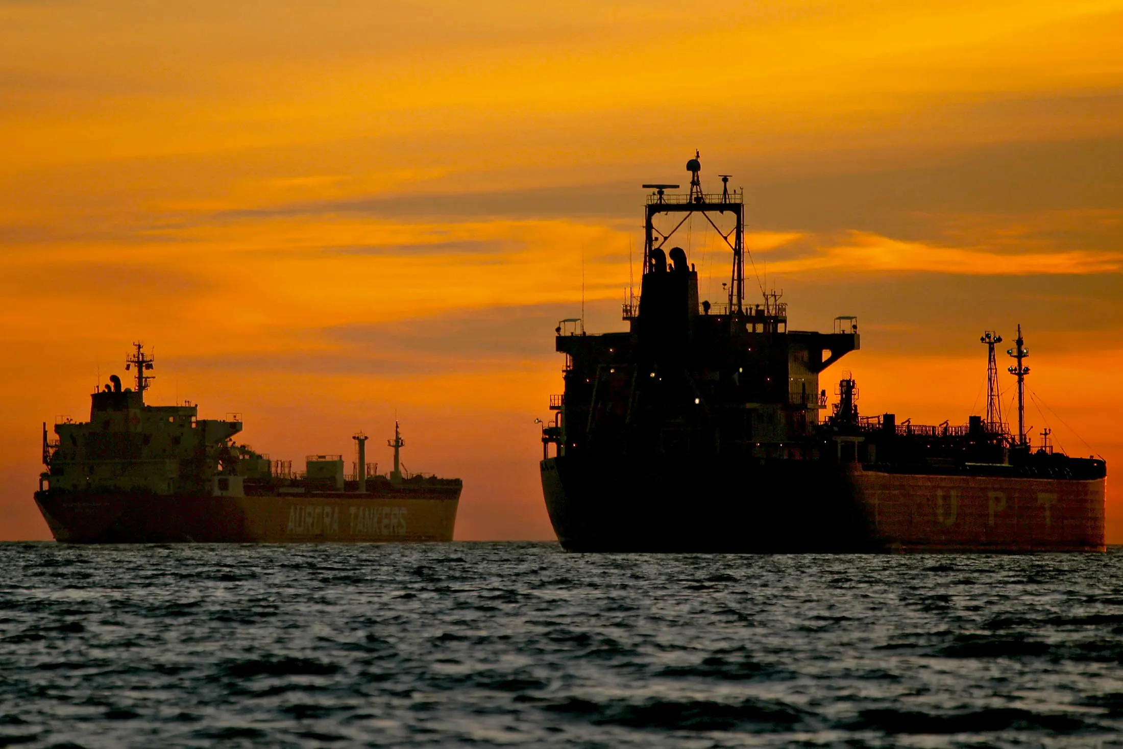 Oil tankers are anchored near the Port of Long Beach, California, U.S., on Thursday, Dec. 31, 2009. A surplus of idled oil tankers, which would stretch 26 miles if lined up end to end, may signal a 25 percent slump in freight rates this year. The ships will unload 26 percent of the crude and oil products they are storing in six months, adding to vessel supply and pushing rates for supertankers down to an average of $30,000 a day, compared with $40,212 now.

