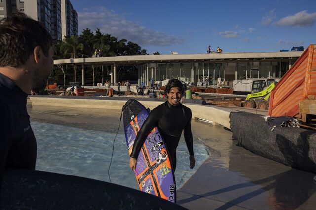 Professional Sufer Gabriel Medina carrying a surf board walks out of the wave pool at beyond The Club. 