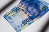 A collection of 100 rand South African banknotes sit in an arranged photo in Johannesburg, South Africa, on Thursday, June 22, 2017. South Africa’s inflation rate rose for the first time this year in May after food-price growth quickened from the slowest pace since December 2015.