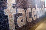 Signage made up of individual faces is displayed inside the Facebook.