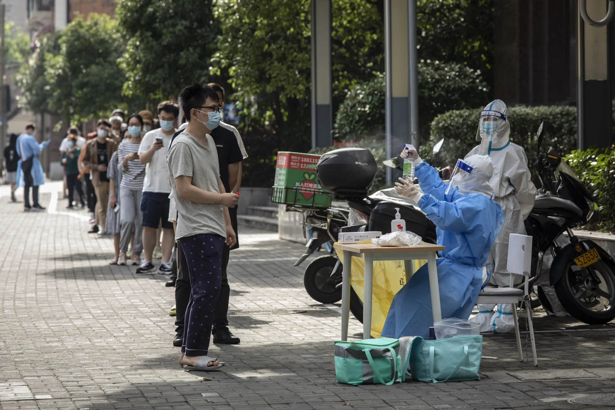 Residents queue for a Covid-19 test in the Hongkou district of Shanghai, China, on&nbsp;June 11.&nbsp;