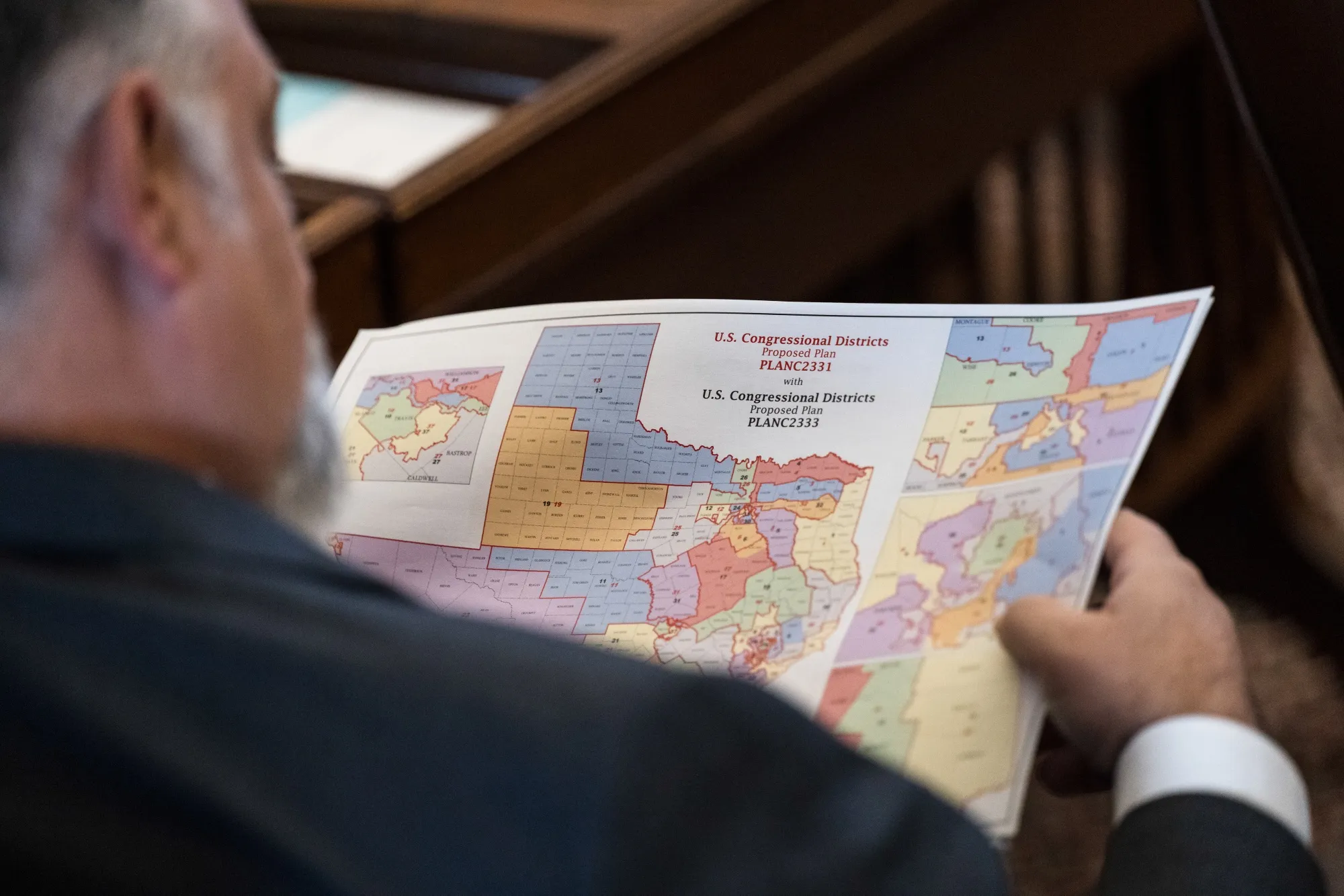 State Representative Matt Morgan, a Republican from Texas, reviews a map of proposed congressional redistricting during a special session at the Texas State Capitol in Austin in August.&nbsp;