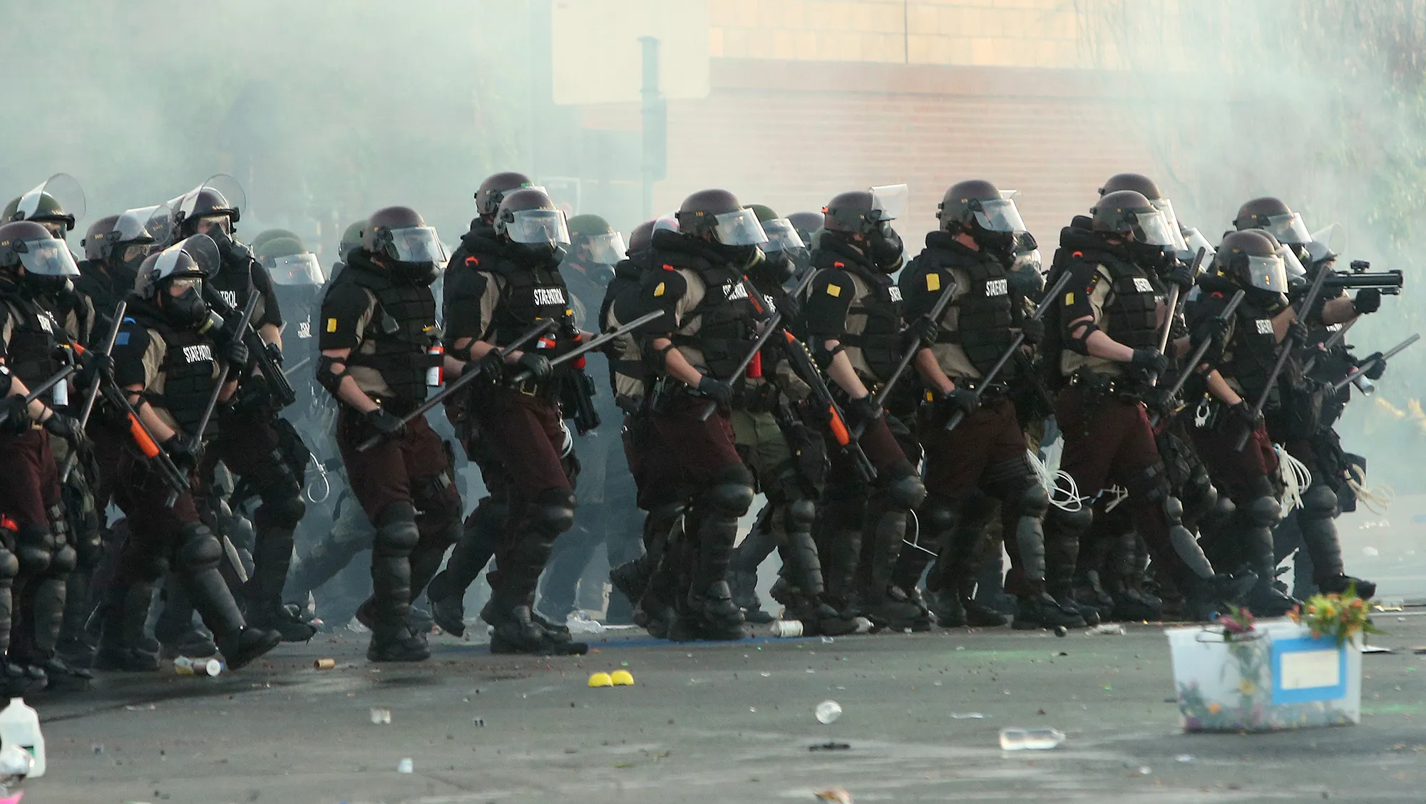 Police advance on demonstrators in Minneapolis on May 30.&nbsp;