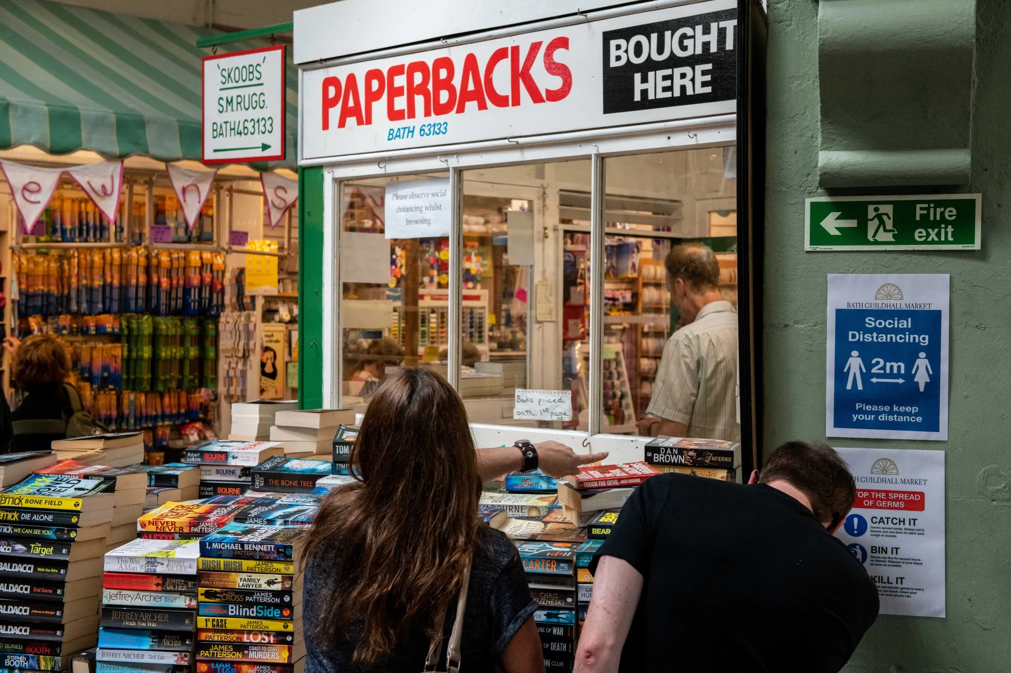 A social distancing sign outside a book stall in Guildhall Market in Bath, U.K., on July 5.