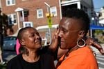 Erricka Bridgeford (right) cries at the &quot;Stop the Violence&quot; rally during the 72-hour Baltimore Ceasefire against gun violence.
