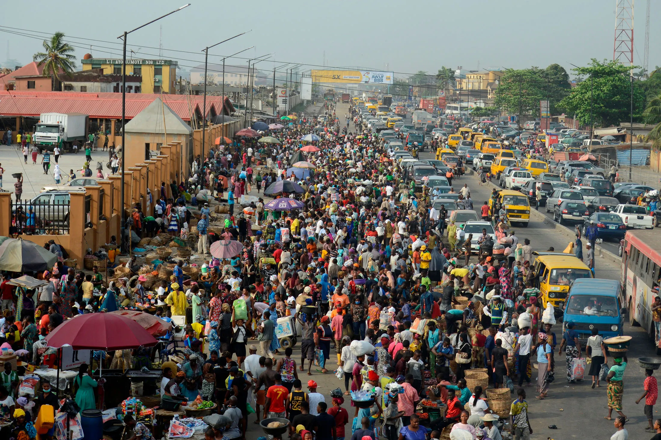 Despite social distancing orders resident cluster at Oke-Odo Market in Lagos, Nigeria on March 30.