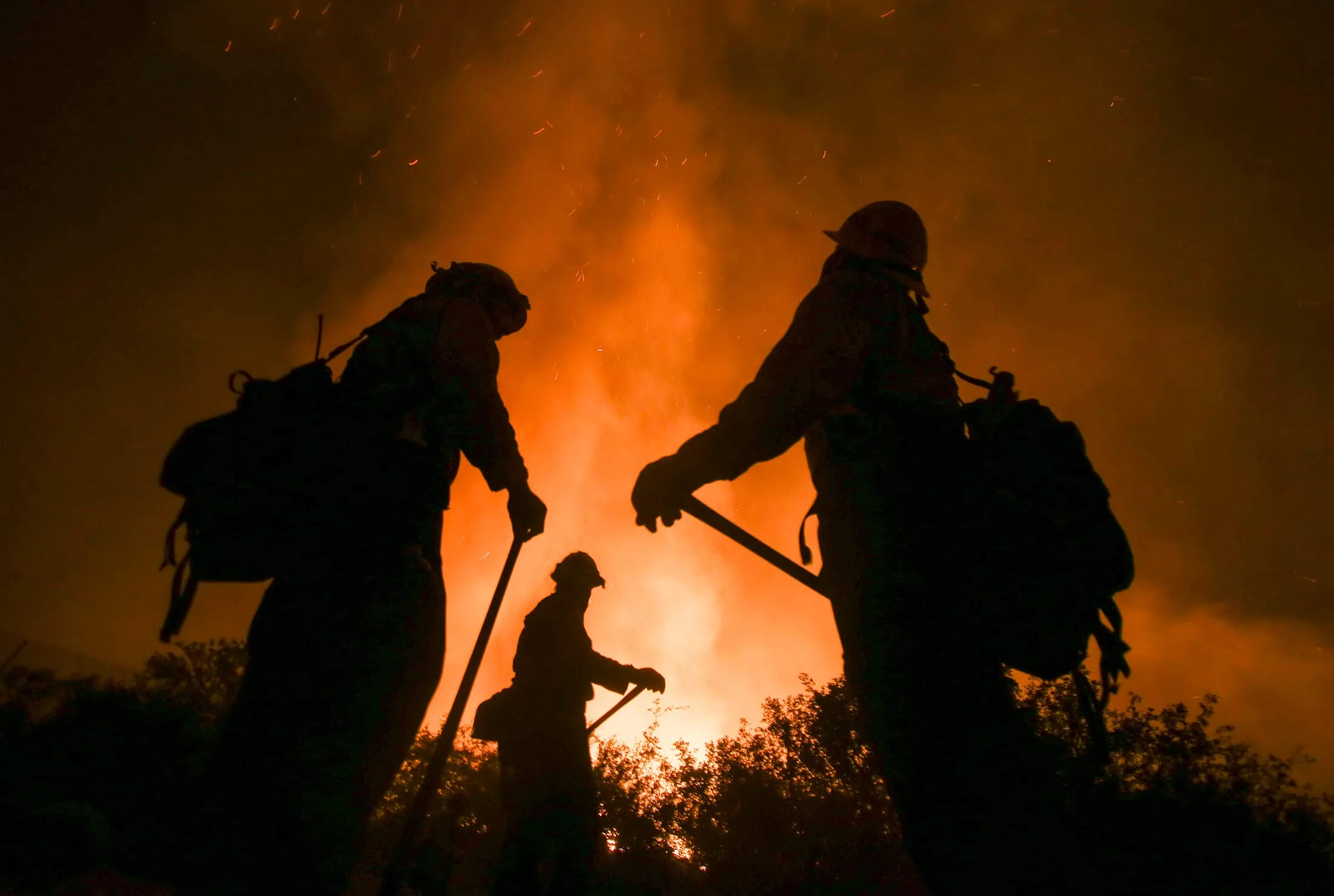 Firefighters battle the Blue Cut wildfire near Cajon Pass, north of San Bernardino, California, on Aug. 16, 2016.
