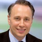 Headshot of Dr Thomas Buberl