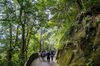People walk on the trail from Harlech Road to High West in Hong Kong on Sept. 26.
