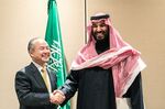 Masayoshi Son, left, shakes hands with Mohammed bin Salman in New York on March 27, 2018.