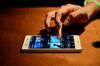 An attendee tries out Spotify Ltd.'s music streaming service, operated by Spotify Japan K.K., on a Sony Corp. smartphone during a launch event in Tokyo, Japan, on Thursday, Sept. 29, 2016. Spotify Ltd. is bringing its popular online music service to Japan, a large and lucrative market where fans have demonstrated a continuing fondness for CDs and even vinyl records.