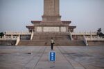 A Chinese paramilitary policeman stands guard at the Monument to the People’s Heroes in Tiananmen Square