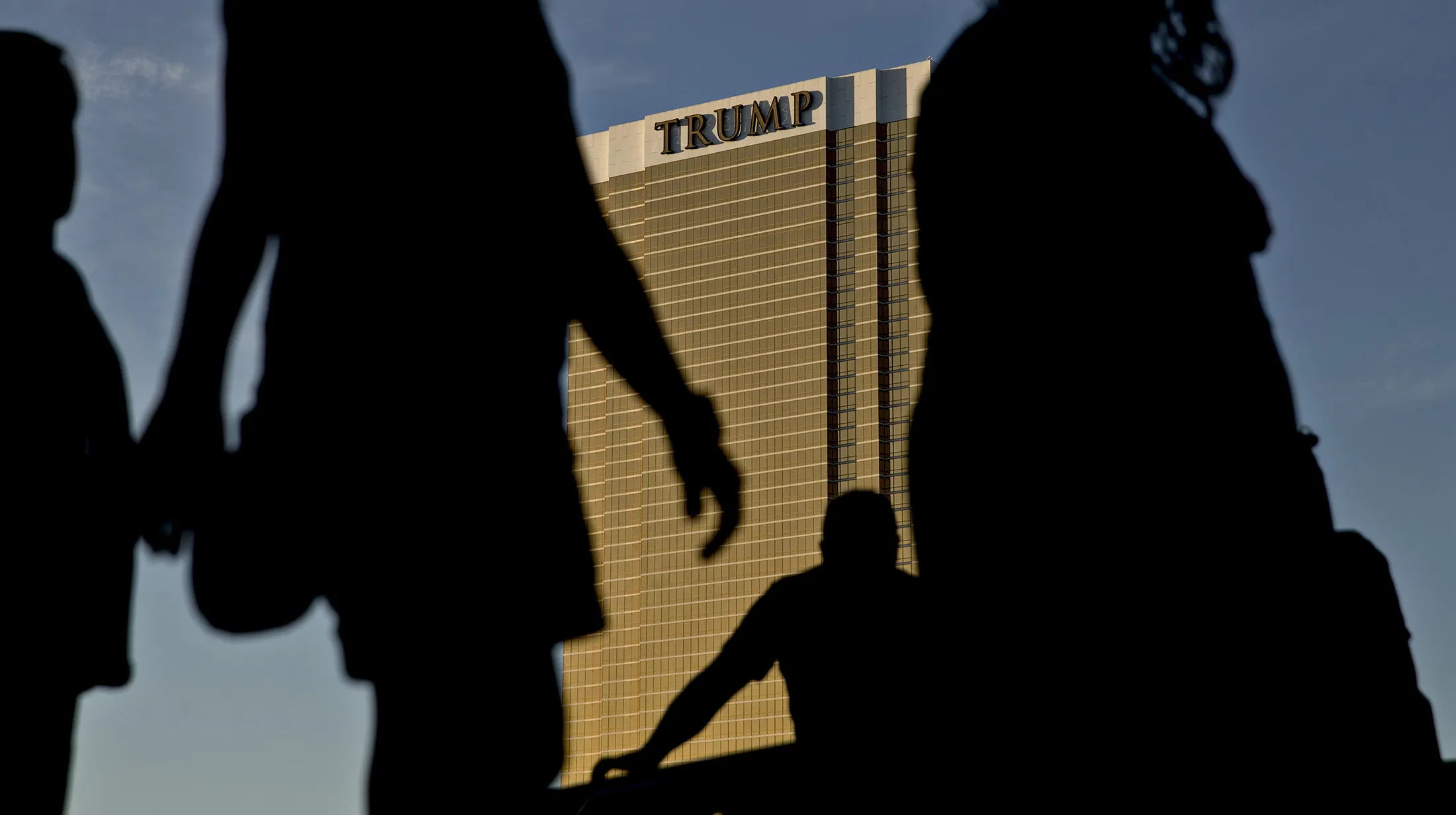 Pedestrians walk past the Trump International Hotel in Las Vegas.
