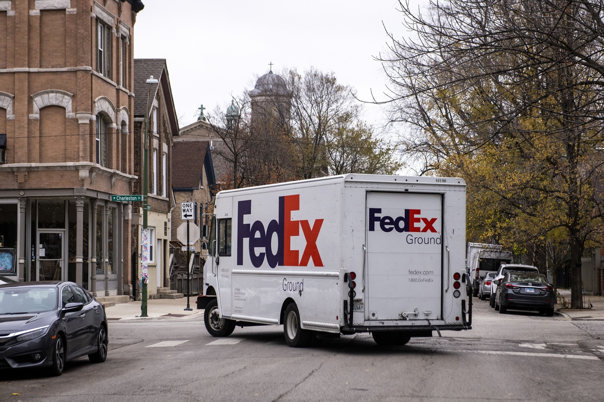 A FedEx Ground truck drives through the Bucktown neighborhood of Chicago.
