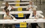 Bipartisan counting teams prepare to recount nearly 150,000 ballots in Wichita, Kansas, on Wednesday, Aug. 17, 2022 on a constitutional amendment that would've removed abortion rights from the Kansas Constitution.  Nine of the state's 105 counties were forced to do the recount by two Republican activists. Voters earlier this month rejected a proposed amendment to the Kansas Constitution that would have allowed the Republican-controlled Legislature to further restrict abortion or ban it. (Jaime Green/The Wichita Eagle via AP)