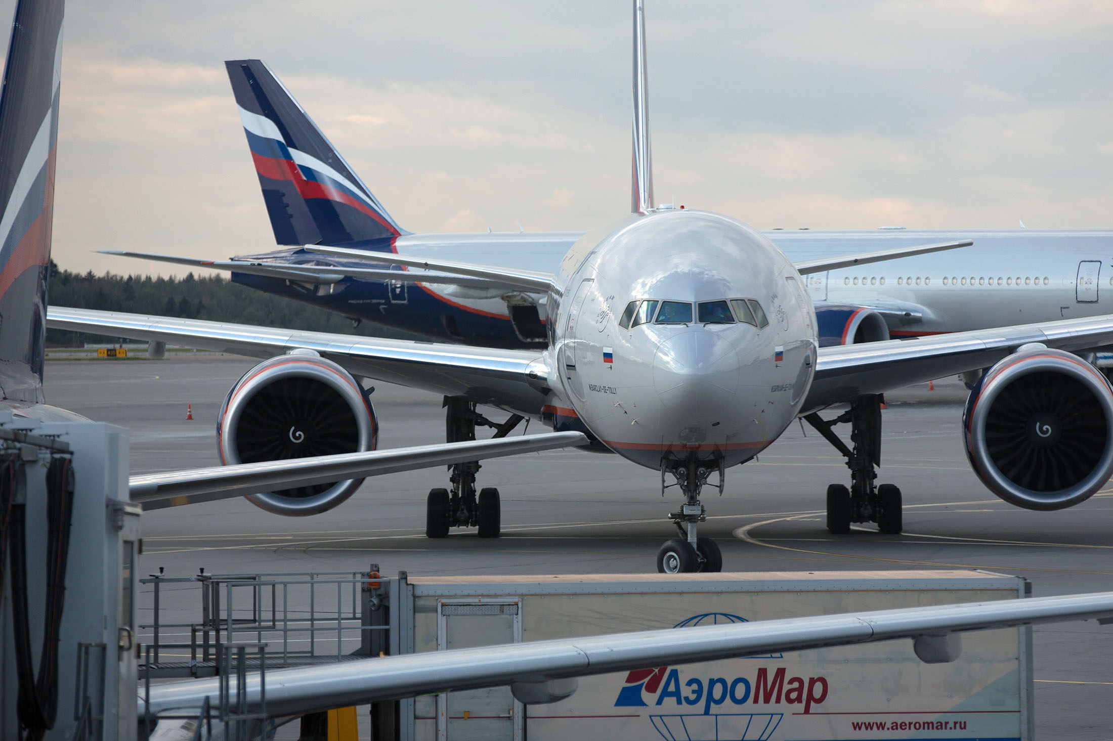 An OAO Aeroflot operated Boeing 777-300ER passenger jet, named M. Barclay de Tolly, taxis at Sheremetyevo airport in Moscow, Russia, on Thursday, Sept. 4, 2014. Russian flag carrier Aeroflot said it will revive plans to build a low-cost arm after discount unit Dobrolet was grounded by European Union sanctions tied to the Ukraine crisis just two months after flights began.
