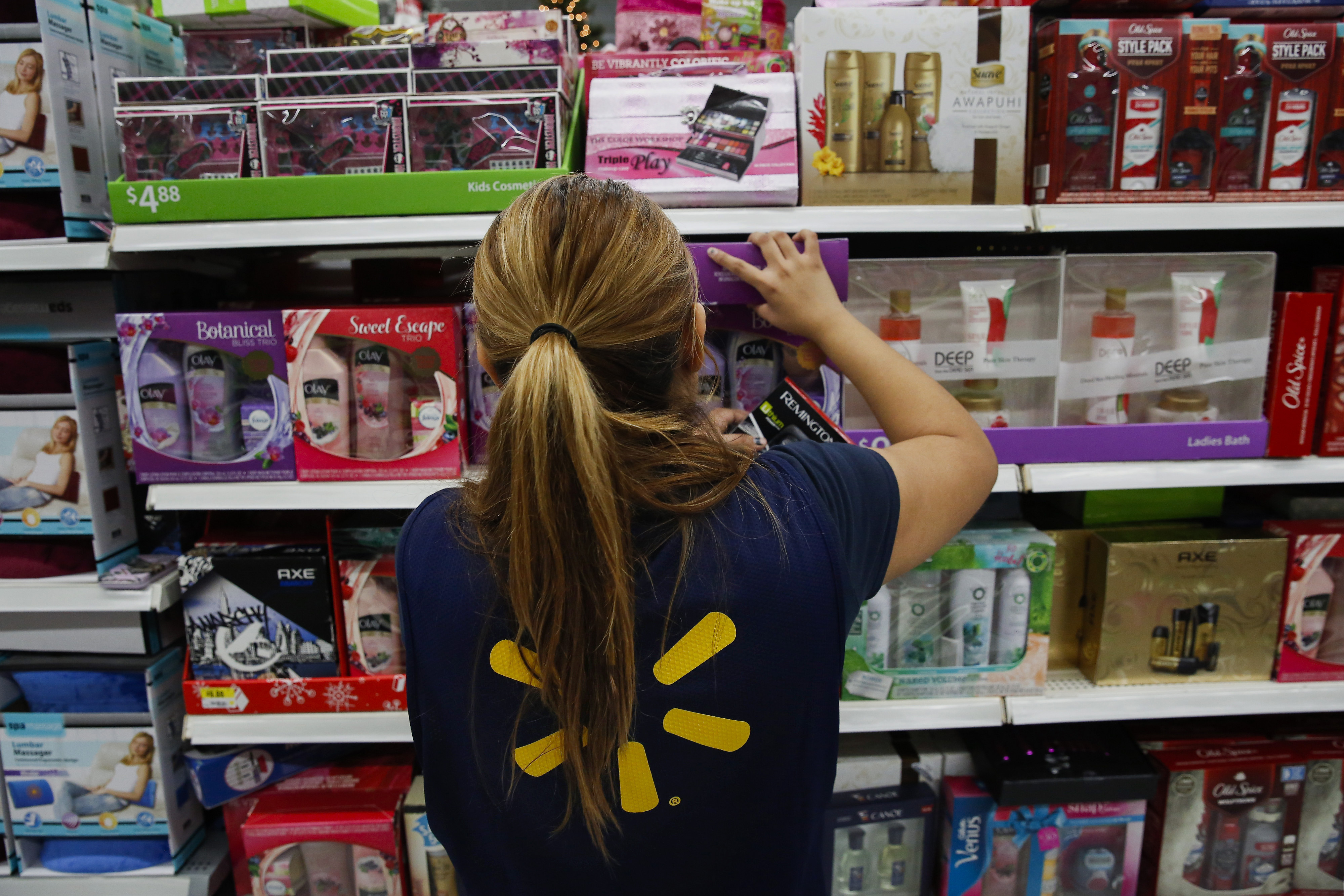 An employee arranges beauty products at a Wal-Mart location in Los Angeles.
