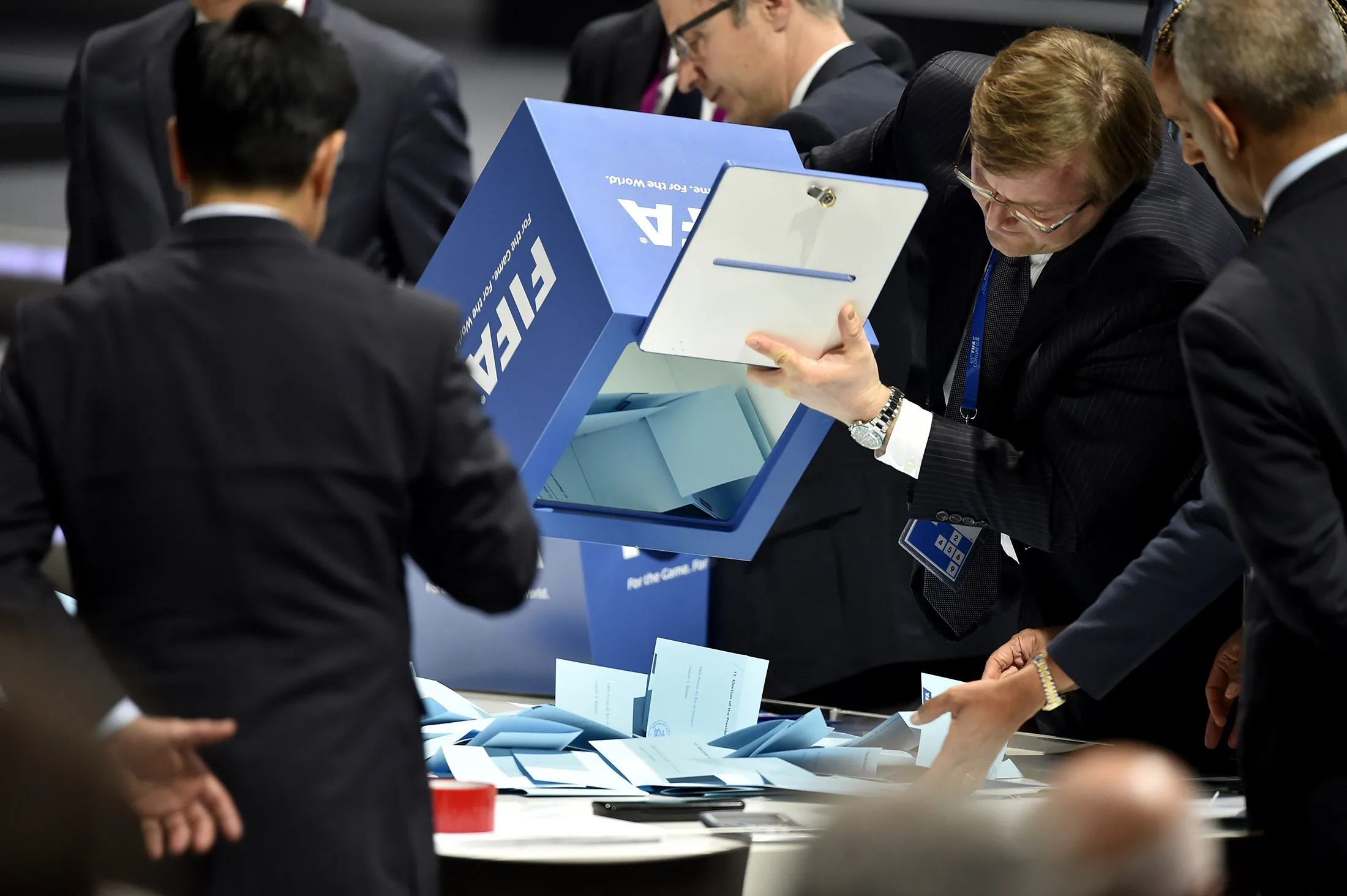 Officials open ballot boxes as vote counting got underway following the vote to decide on the FIFA presidency in Zurich on May 29, 2015.
